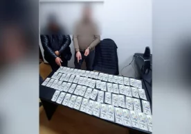 Тошкентда қалбаки 6900 долларни сотмоқчи бўлган уч киши қўлга олинди фото