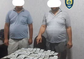 Самарқандда 3700 долларни 40,3 млн сўмга сотмоқчи бўлган валютафуруш ушланди фото