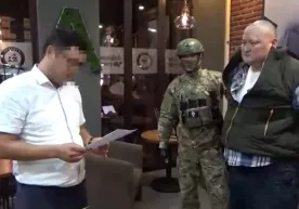Қирғизистон президенти ёрдамчисидан қиймати 300 минг долларга тенг 12 та биткоин ундиришди фото