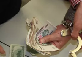 Kollej direktori 150 AQSH dollari pora bilan qoʻlga tushdi (foto) фото