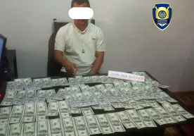 Қашқадарёда икки кишини ўқишга киритиб қўйиш учун 10 минг доллар пора олган шахс қўлга тушди фото