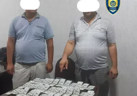 Самарқандда 3700 долларни 40,3 млн сўмга сотмоқчи бўлган валютафуруш ушланди фото