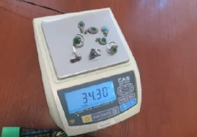 Koʻylak yoqasiga yashirilgan kumushlar fosh boʻldi фото