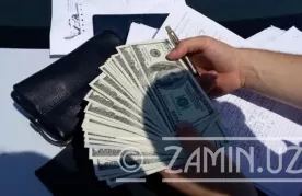 Ўзбекистонда сохта доллар сотувчилари қўлга олинди фото