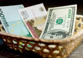 Долларнинг расмий курси 8000 сўмдан пастга тушди фото