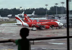 Филиппинда AirAsia самолёти учиш-қўниш йўлагидан чиқиб кетди фото