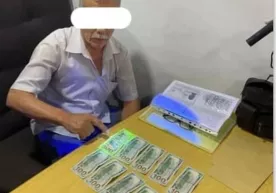 «Ирригация»га ўқишга киритиш учун 5 минг доллар сўраган шахс ушланди фото