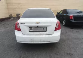 Dang‘arada jarima maydoniga olib kirilgan Lacetti sotildi фото