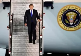 Трамп Ким Чен Ин билан учрашув учун Сингапурга етиб борди фото