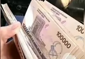 Андижондаги бозорда қалбаки 100 минг сўмлик пуллар аниқланди фото