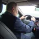 Путин қайта таъмирланган Қрим кўприги бўйлаб машинада ҳаракатланди (видео)